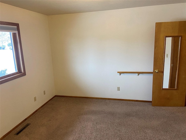 unfurnished room featuring carpet floors