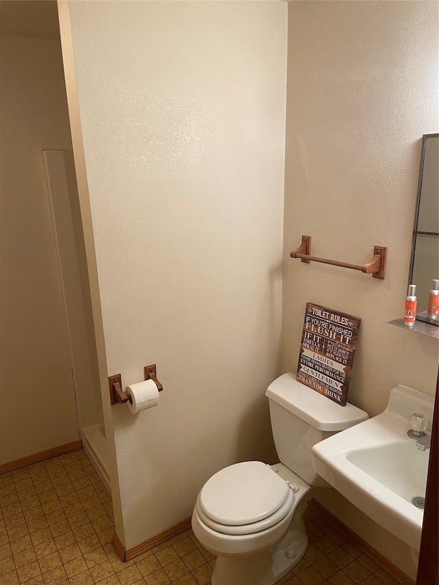 bathroom with toilet and sink