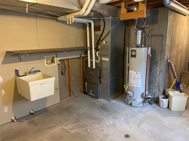 utilities with gas water heater, sink, and heating unit