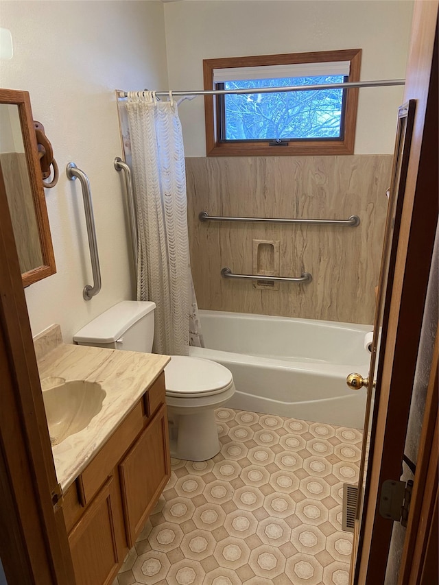 full bathroom featuring tile patterned floors, vanity, toilet, and shower / bathtub combination with curtain