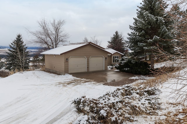 snow covered property with a mountain view