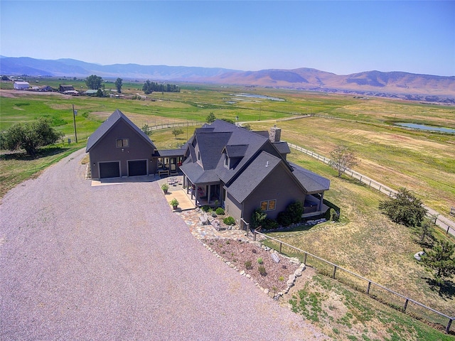 aerial view featuring a mountain view and a rural view