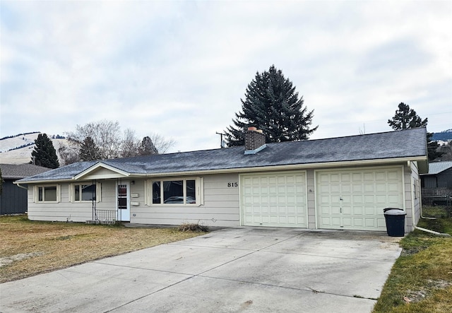 ranch-style home featuring a garage