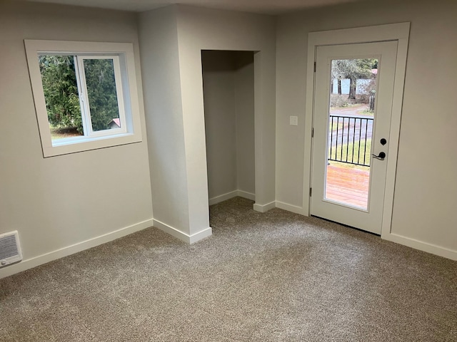 206 Waterfront Rd, Troy, MT 59935 - doorway featuring carpet flooring, visible vents, baseboards, and a wealth of natural light