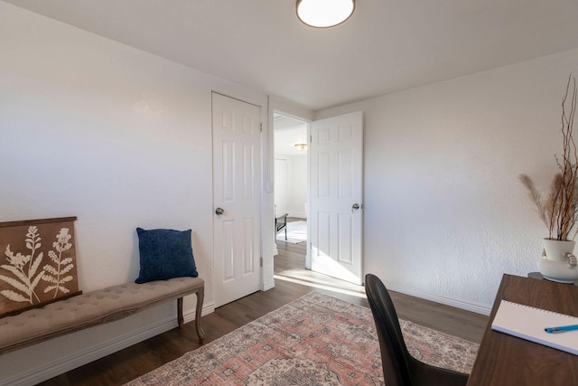 home office with dark wood-type flooring