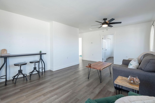 living room with hardwood / wood-style flooring and ceiling fan