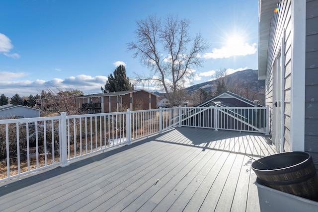 wooden deck featuring a mountain view