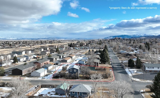 birds eye view of property featuring a mountain view