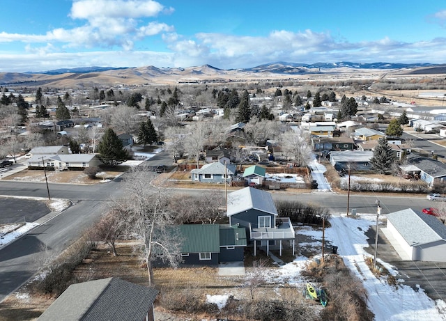 snowy aerial view with a mountain view