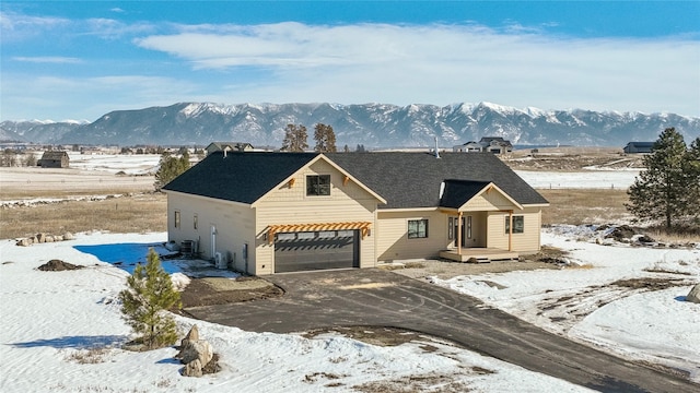 view of front of home featuring a mountain view and driveway