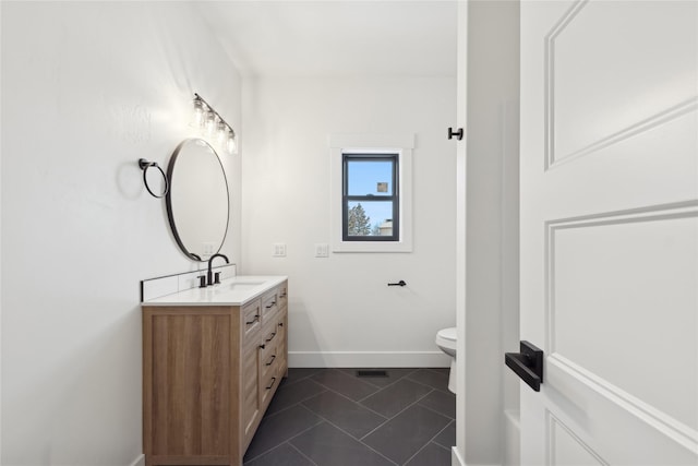 bathroom with tile patterned flooring, toilet, visible vents, vanity, and baseboards