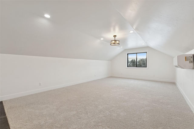 bonus room with vaulted ceiling, recessed lighting, light colored carpet, and baseboards