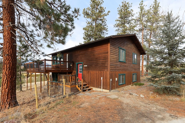 view of property exterior featuring a deck