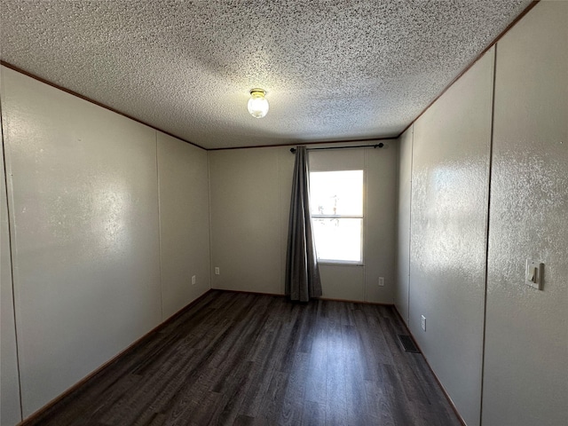 empty room featuring dark wood-type flooring