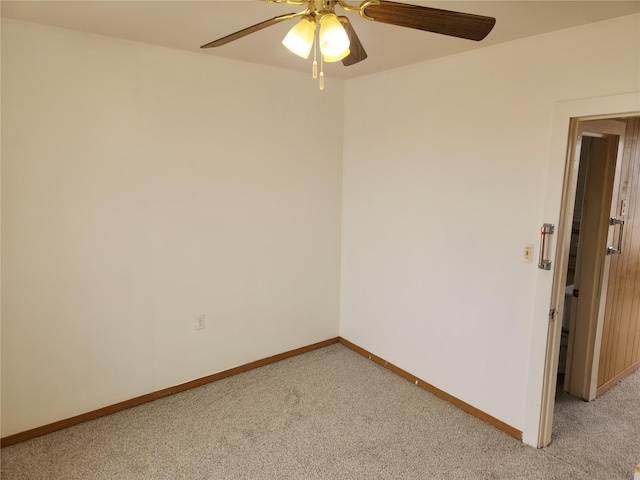 unfurnished room with baseboards, light carpet, and ceiling fan