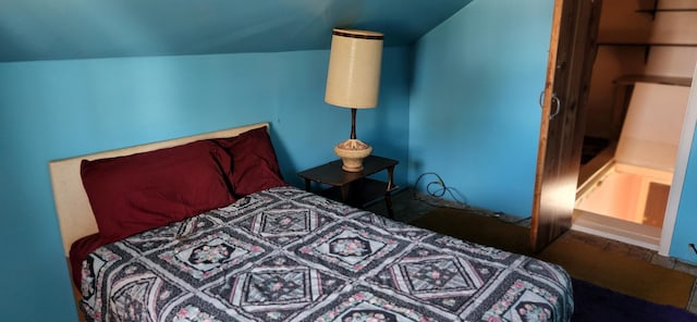 bedroom with lofted ceiling