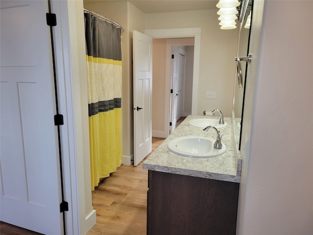 bathroom featuring vanity and hardwood / wood-style flooring