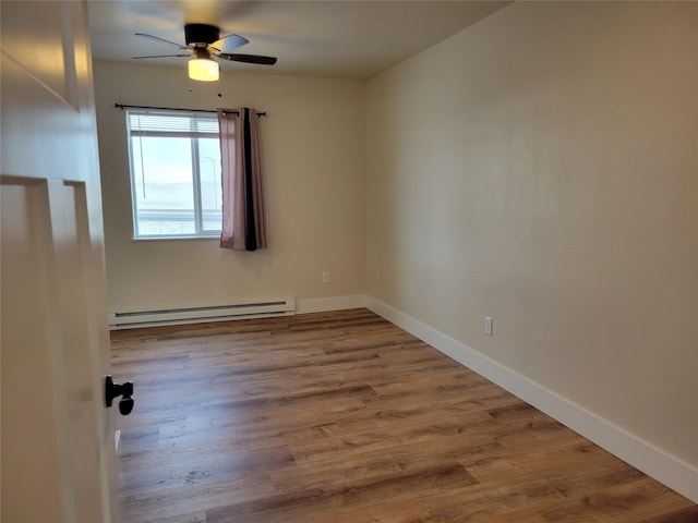 unfurnished room with hardwood / wood-style floors, ceiling fan, and baseboard heating