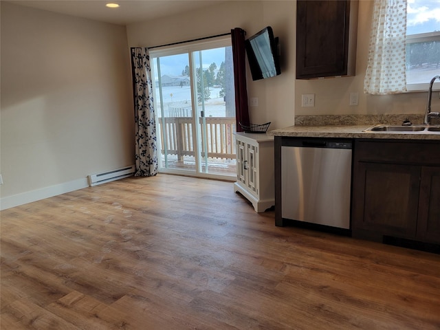 kitchen with a baseboard heating unit, sink, light hardwood / wood-style flooring, stainless steel dishwasher, and dark brown cabinetry