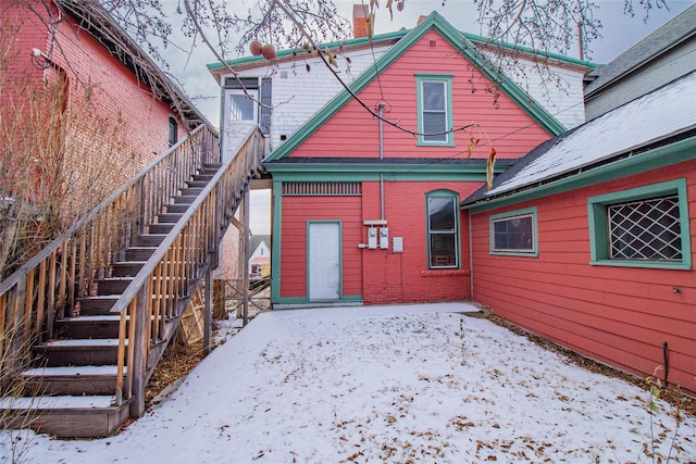 view of snow covered house