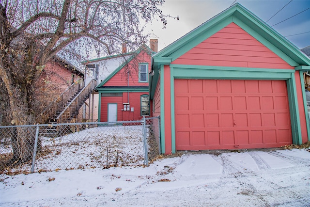 view of snow covered garage