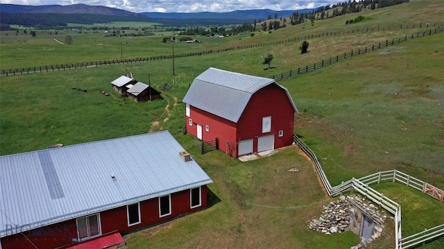 bird's eye view with a mountain view and a rural view