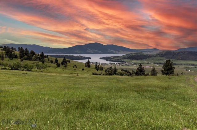 mountain view with a rural view and a water view