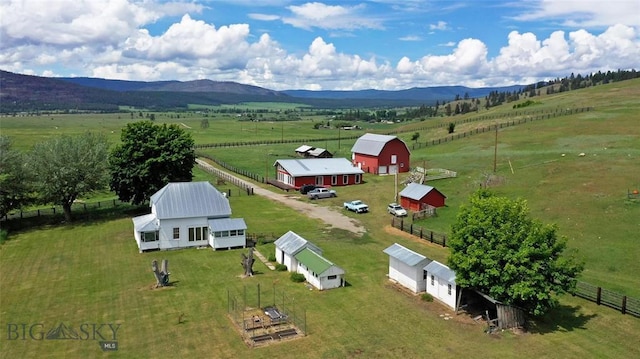 aerial view with a mountain view and a rural view