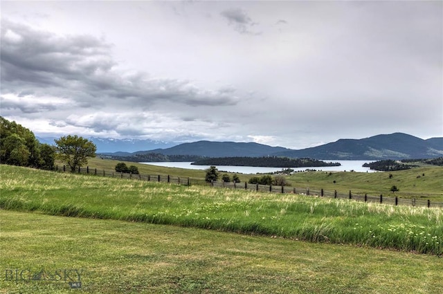 mountain view featuring a water view and a rural view