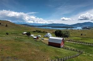 view of mountain feature featuring a rural view and a water view