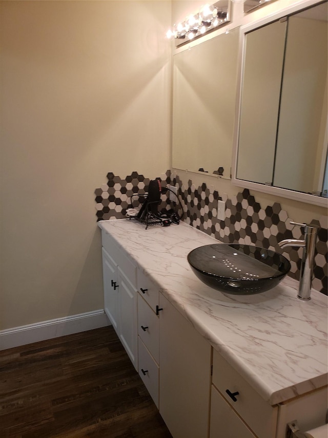 bathroom featuring wood-type flooring and vanity