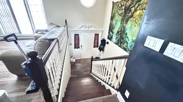 stairway with hardwood / wood-style floors