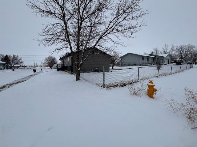 view of yard covered in snow