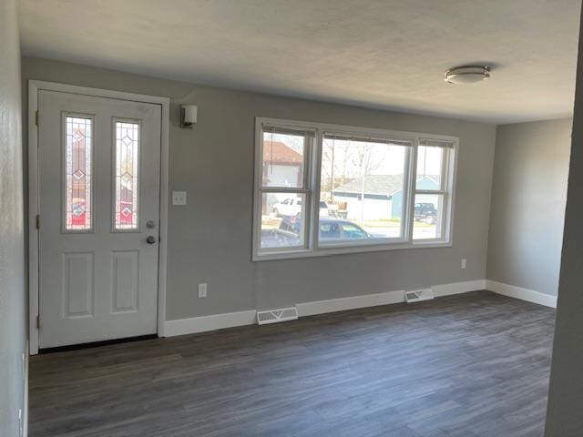 foyer featuring dark hardwood / wood-style floors