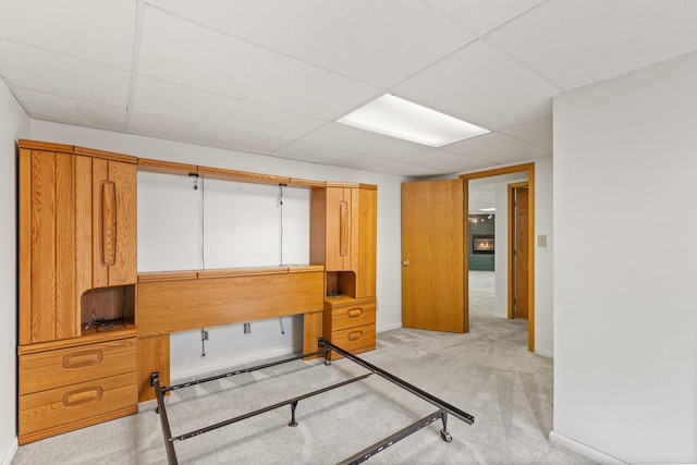 office space featuring light carpet and a drop ceiling