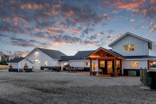 view of back house at dusk