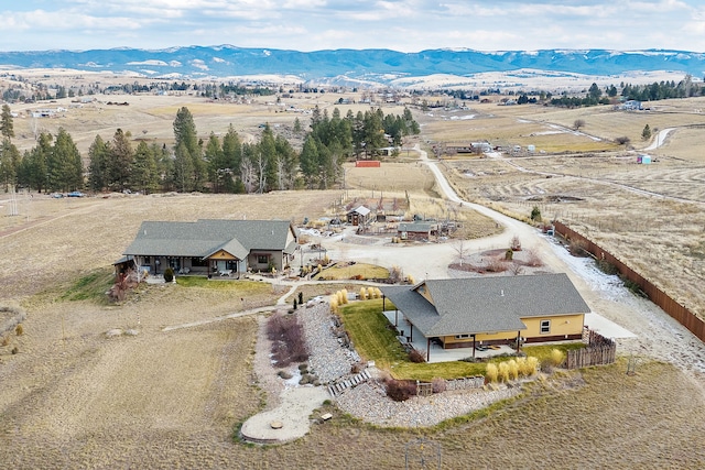 birds eye view of property featuring a mountain view and a rural view