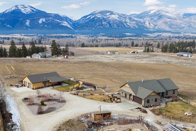 drone / aerial view with a mountain view and a rural view