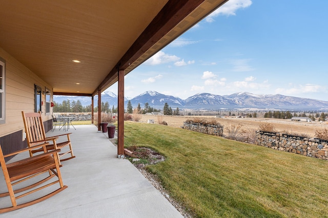 view of patio with a mountain view and a rural view