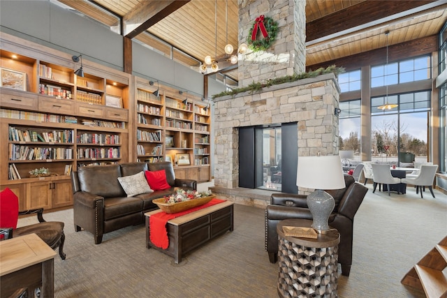 carpeted living room with beam ceiling, a towering ceiling, and wood ceiling