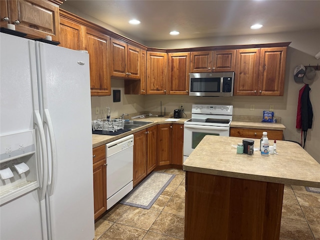 kitchen with sink and white appliances