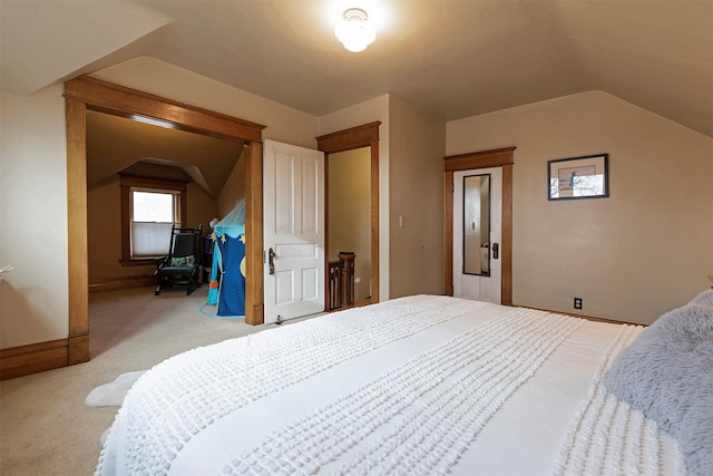 carpeted bedroom with vaulted ceiling