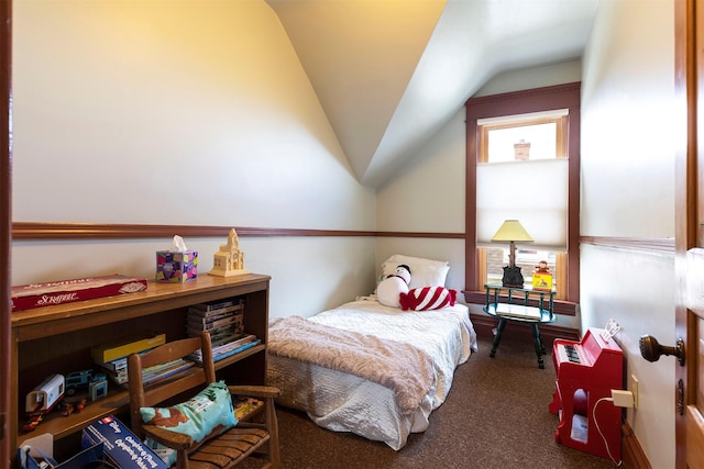 carpeted bedroom with vaulted ceiling