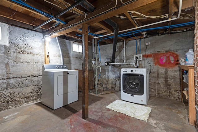 basement featuring washing machine and clothes dryer