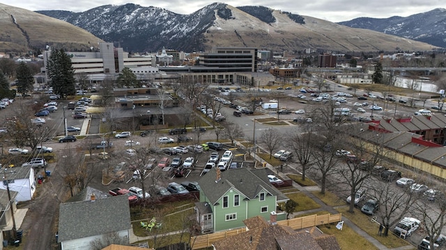 birds eye view of property featuring a mountain view