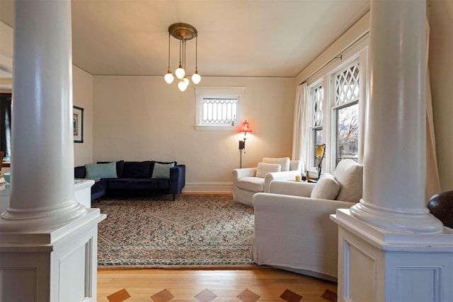 living room with plenty of natural light and light hardwood / wood-style floors