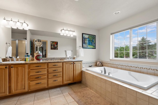 bathroom featuring tile patterned floors, vanity, and independent shower and bath