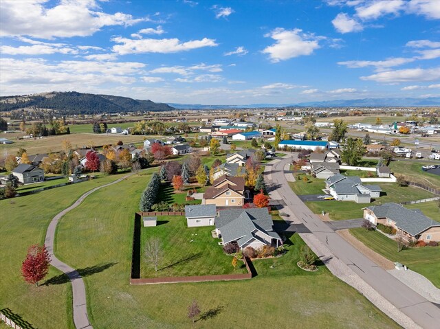 birds eye view of property featuring a mountain view