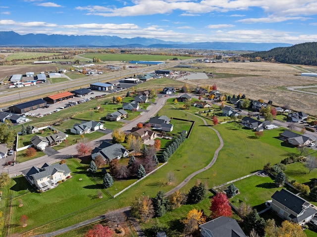 birds eye view of property with a mountain view