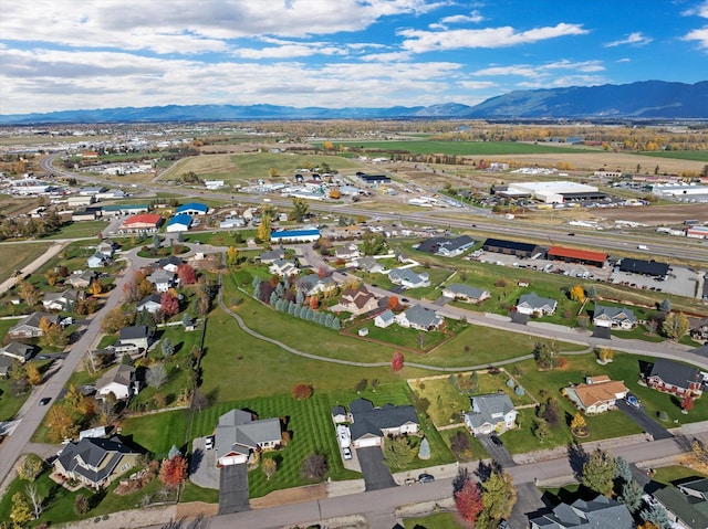 birds eye view of property featuring a mountain view